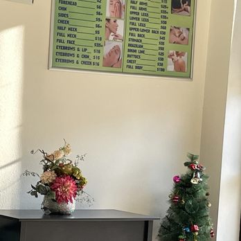 Ideal Threading - Christmas tree next to price list - Threading Services Near Me - Pomona, California