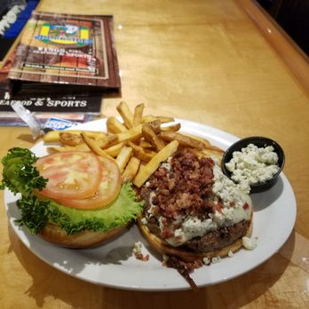 Gators Dockside - Burger night special. Bacon bits, blue cheese - Seafood Near Me - Orlando, Florida Gators Dockside - Burger night special. Bacon bits, blue cheese - Seafood Near Me - Orlando, Florida