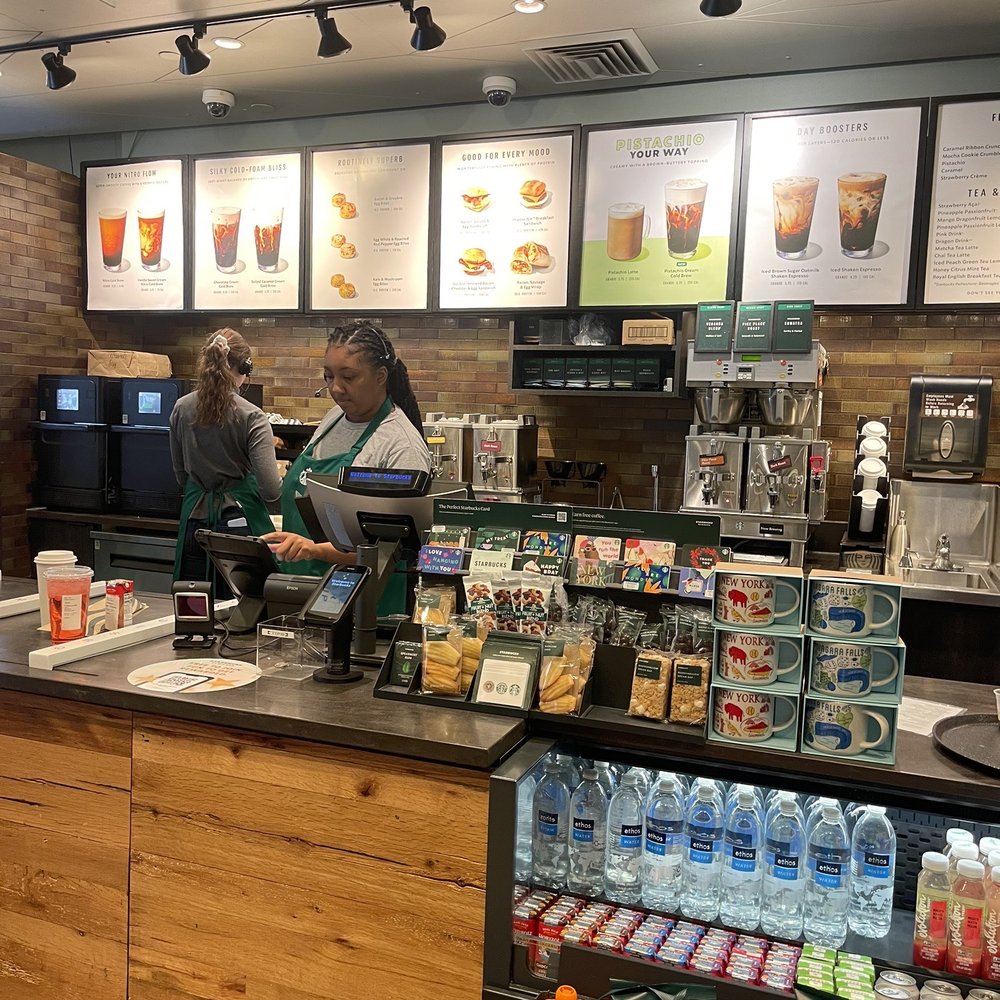 Starbucks - a woman working at a coffee shop - Coffee & Tea Near Me - Williamsville, New York Starbucks - a woman working at a coffee shop - Coffee & Tea Near Me - Williamsville, New York