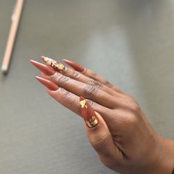 Lovie Nail Spa - I told her I wanted a Thanksgiving vibe and she came up with this lovely design! $95 (I also got a set removed)
