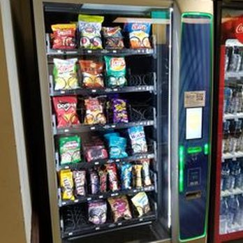 Rawlins Hall - Vending machines on the first floor outside the laundry room. - University Housing Near Me - Denton, Texas