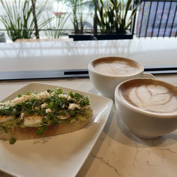 Gris Azul Cafe - Avocado toast with lattes on open window counter top - Coffee & Tea Near Me - Los Angeles, California Gris Azul Cafe - Avocado toast with lattes on open window counter top - Coffee & Tea Near Me - Los Angeles, California