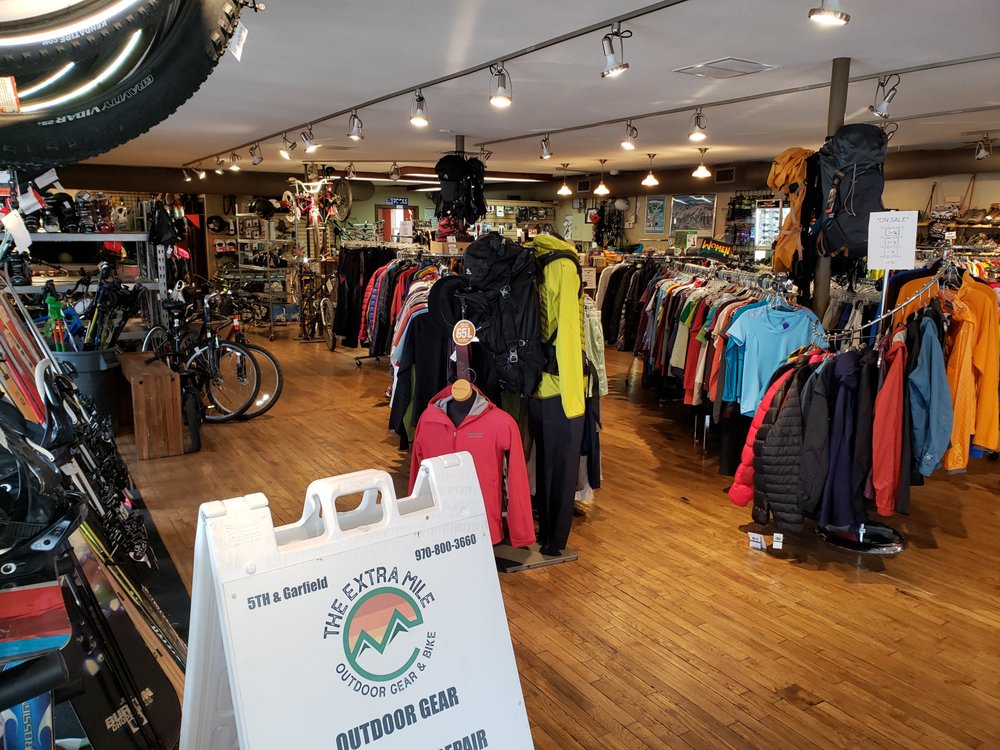 The Extra Mile Outdoor Gear & Bike Logo