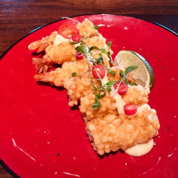 Sticks N Sushi - Eli tempura - prawn tempura in mayo sauce with chilli and coriander on top - Sushi Bars Near Me - Oxford, OXF Sticks N Sushi - Eli tempura - prawn tempura in mayo sauce with chilli and coriander on top - Sushi Bars Near Me - Oxford, OXF