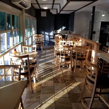 O'ahu Grill - Upper level seating area... with the sun casting odd shadows as it sets... - Hawaiian Near Me - Honolulu, Hawaii O'ahu Grill - Upper level seating area... with the sun casting odd shadows as it sets... - Hawaiian Near Me - Honolulu, Hawaii