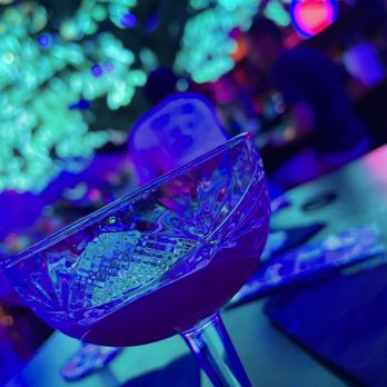 Oddwood - a close up of a glass of wine on a table - Cocktail Bars Near Me - Las Vegas, Nevada Oddwood - a close up of a glass of wine on a table - Cocktail Bars Near Me - Las Vegas, Nevada