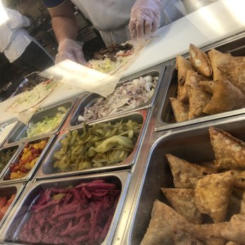 Butter Chicken Hut - a chef preparing food in a kitchen - Indian Near Me - Calgary, Alberta Butter Chicken Hut - a chef preparing food in a kitchen - Indian Near Me - Calgary, Alberta