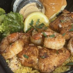 Round The Way Eatery - Shrimp & Salmon over yellow rice with crab meat & broccoli