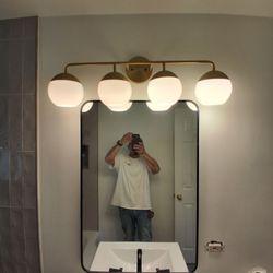 Rudy's Custom Carpentry - I assembled this setup of the light, mirror, and the sink and faucet