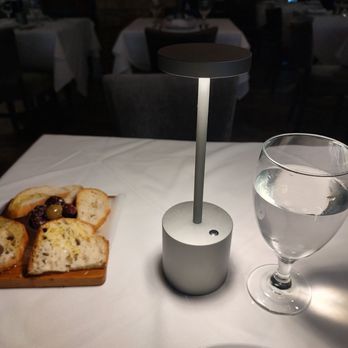 Ammos Estiatorio - Bread and olives to start - Greek Near Me - New York, New York Ammos Estiatorio - Bread and olives to start - Greek Near Me - New York, New York