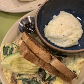 Snooze, an A.M. Eatery - 3 Egg Omelet with avocado, toast and grits - Breakfast & Brunch Near Me - Austin, Texas Snooze, an A.M. Eatery - 3 Egg Omelet with avocado, toast and grits - Breakfast & Brunch Near Me - Austin, Texas