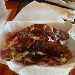 Photo of Tequileria - Charlotte, NC, United States. Avocado toast (on a crispy tortilla -- ran out of bread) with bacon on the side!