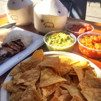 Bear Flag Fish - Yellowtail plate, chips and guac, poke (ahi and salmon), coconut. Yum. - Seafood Near Me - Newport Beach, California