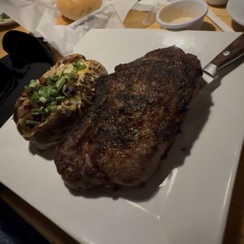 Bison Steakhouse - Ribeye steak bone in and loaded baked potato - Steakhouses Near Me - Broken Arrow, Oklahoma Bison Steakhouse - Ribeye steak bone in and loaded baked potato - Steakhouses Near Me - Broken Arrow, Oklahoma