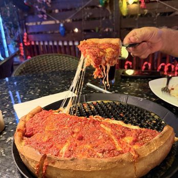 Giovannis Pizzeria Restaurant - Chicago Style pizza with peperoni and sausage. - Pizza Near Me - Boca Raton, Florida