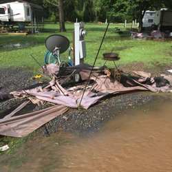 Springbrook Family Campground - That was my gazebo, table, and other items. Owners never even offered to help. Just sat and watched.