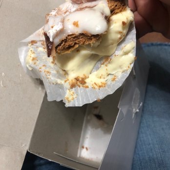 Benkert's Bakery - a hand holding a piece of cake - Bakeries Near Me - Centereach, New York