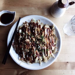 a plate of food with chopsticks a plate of food with chopsticks