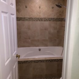 a bathtub and shower a bathtub and shower