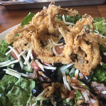 Roots - Chopped salad with a side of brisket.  The onion straws were so good on this salad. - Barbeque Near Me - Almont, Michigan