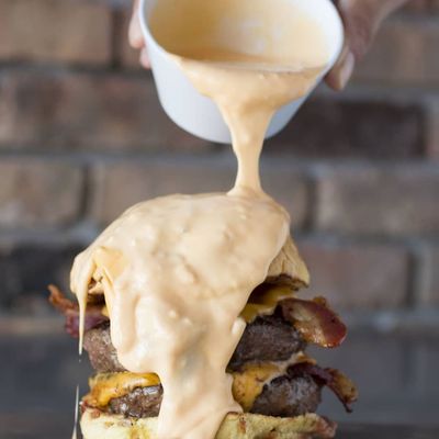 Photo of Tucker Duke's - Deerfield Beach - Deerfield Beach, FL, US. The Big Hoss 
Two 6oz Patty's, 4 slices of American cheese, 4 slices of bacon, on a toasted onion roll all covered in cheese sauce!