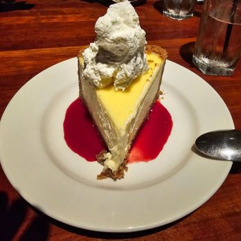 J. Alexander's - Key Lime Cheesecake with Raspberry Sauce - New American Near Me - Atlanta, Georgia