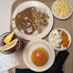 Country Style Steak Macaroni & Cheese and sweet potato Yam Souffle a roll and sweet tea