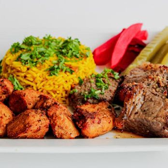 Montaha's - a plate of meat, rice, pickles and pickles - Bistros Near Me - Swift Current, Saskatchewan Montaha's - a plate of meat, rice, pickles and pickles - Bistros Near Me - Swift Current, Saskatchewan