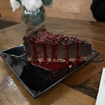 Tarantino's Vegan - GF Dark Chocolate Raspberry Cheesecake (didn't care of the chocolate chips tho)... took away from the raspberry sauce and cheesecake - Vegan Near Me - Las Vegas, Nevada Tarantino's Vegan - GF Dark Chocolate Raspberry Cheesecake (didn't care of the chocolate chips tho)... took away from the raspberry sauce and cheesecake - Vegan Near Me - Las Vegas, Nevada