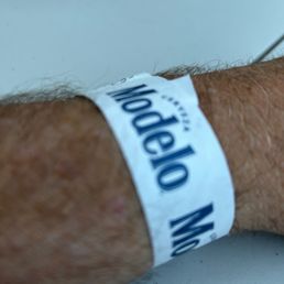 a man's hand with a wristband a man's hand with a wristband