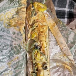 Sandwich drowning in sauce.