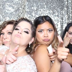 Capture Entertainment - Classic open-air wedding photo booth setup with a DSLR camera, studio lighting, props and a premium backdrop.