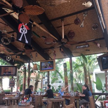 Grind At Kona Tiki Bar - Atmosphere is awesome! Giant tiki hut, bar, music, tv's in caddies at bar! Menu will please every meat and fish lover. ***** - New American Near Me - Ormond Beach, Florida Grind At Kona Tiki Bar - Atmosphere is awesome! Giant tiki hut, bar, music, tv's in caddies at bar! Menu will please every meat and fish lover. ***** - New American Near Me - Ormond Beach, Florida