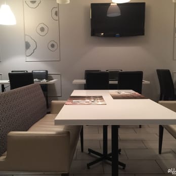 Ave Seoul - a dining area with a flat screen tv - Korean Near Me - Montreal, Quebec