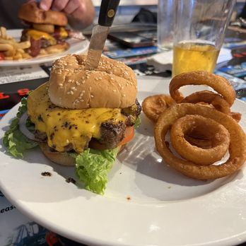 Dibble Creek Outpost - Classic Bruce burger with onion rings. It was delicious! This place is awesome, I will be back for sure. - Bars Near Me - Red Bluff, California