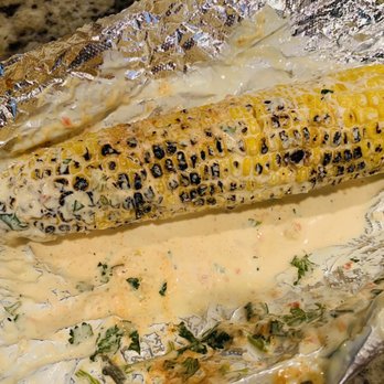 Paseo - World Famous Roast Corn $6. Did take out so the aioli and cheese melted off. Still good! - Caribbean Near Me - Issaquah, Washington Paseo - World Famous Roast Corn $6. Did take out so the aioli and cheese melted off. Still good! - Caribbean Near Me - Issaquah, Washington
