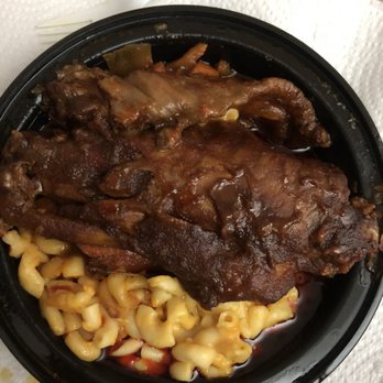 Bronx Soulfood Restaurant - Turkey wings (supposed to be just fried not this bbq shit) Mac & cheese , and yams (somewhere under the juice/oil /fatty grease). - Soul Food Near Me - Bronx, New York