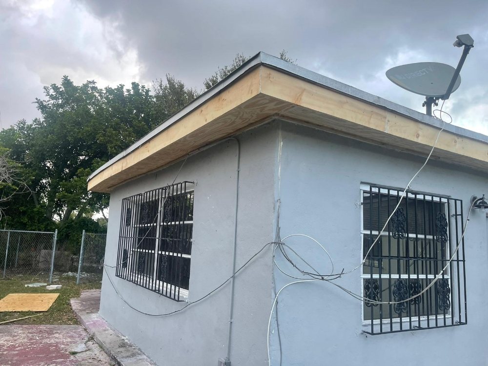 Slide of Escobar Roofing