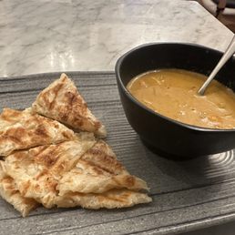 Roti with Massaman curry sauce. Roti with Massaman curry sauce.
