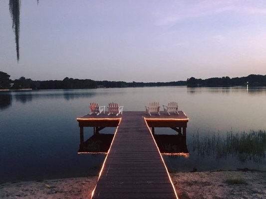 Amenities - Sunshine Lodge is a remote hideaway of peace and serenity, yet it is close to many area activities. Fish, Kayak, Water Ski or just relax at one of the prettiest spot on Lake Tsala Apopka. Sunshine Lodge is surrounded on three sides by water. The spacious grounds, large picnic pavilion with barbecue grill and four fishing docks are available to all our guests to enjoy. This is a great getaway for the whole family. Amenities - Sunshine Lodge is a remote hideaway of peace and serenity, yet it is close to many area activities. Fish, Kayak, Water Ski or just relax at one of the prettiest spot on Lake Tsala Apopka. Sunshine Lodge is surrounded on three sides by water. The spacious grounds, large picnic pavilion with barbecue grill and four fishing docks are available to all our guests to enjoy. This is a great getaway for the whole family.