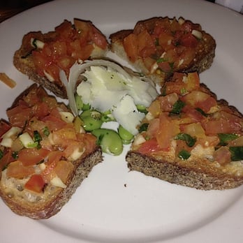 Fiat Cafe - Bruschetta: Tomatoes & Garlic served with parsley and olive oil. - Italian Near Me - New York, New York