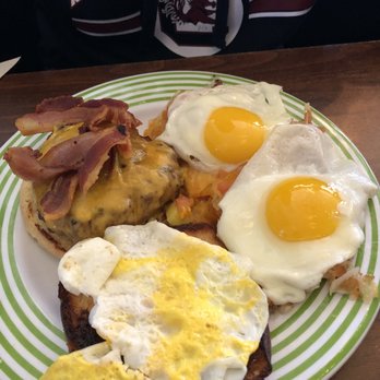 Cafe Strudel - Breakfast burger and hash with sunny side up eggs on top of the hashbrowns - New American Near Me - West Columbia, South Carolina
