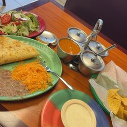 San Jose Supermarket - Asada steak Quesadillas with rice and beans, side salad. Chips and queso. Signature salsa
