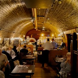 The dining room is in an 18th Century wine cellar. The dining room is in an 18th Century wine cellar.