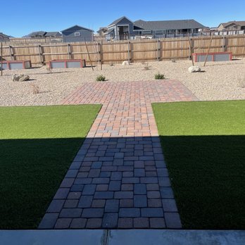 New Life Landscapes - Partial picture of backyard.  Everything on drip.  Dogs loving the amount of artificial turf. - Landscaping Near Me - Prescott Valley, Arizona