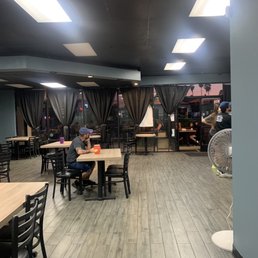 Inside seating area, with a small outside patio in front of the entrance Inside seating area, with a small outside patio in front of the entrance