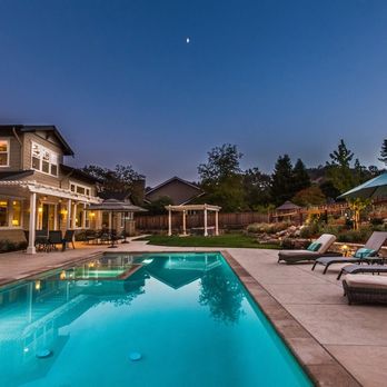 Meadowbrook Design - a pool with lounge chairs and umbrellas - Landscaping Near Me - Martinez, California Meadowbrook Design - a pool with lounge chairs and umbrellas - Landscaping Near Me - Martinez, California