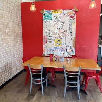 Griddlecakes - A table with some wall art. - American Near Me - Las Vegas, Nevada