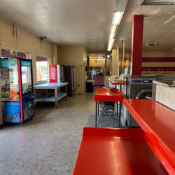 Adobe Acres Laundromat & Dry Cleaners - Dry cleaners on one end