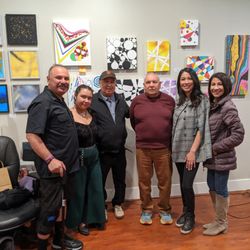 Artbeat Gallery Studio and Gift Shop - Artist Carlos Luis Olivas, Jr. and his son during his Artist Reception for his opening